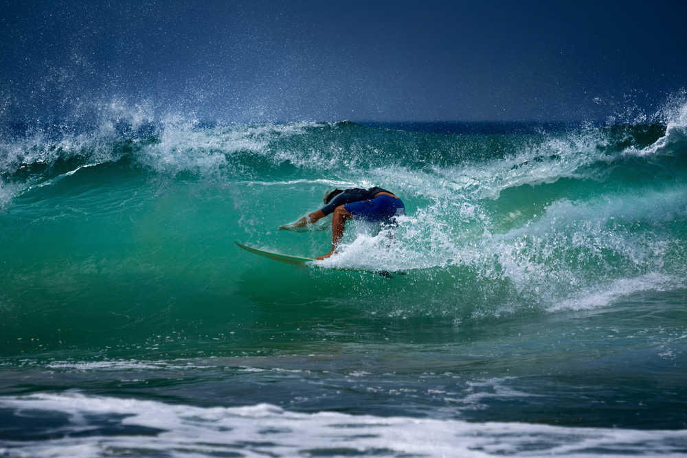 Surfer enjoying the waves in Midigama spot, Sri Lanka.