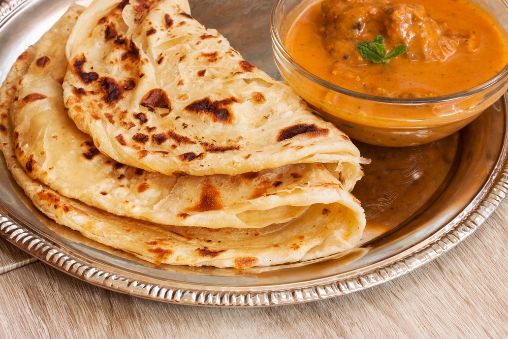Roti with a side dish of Chicken curry