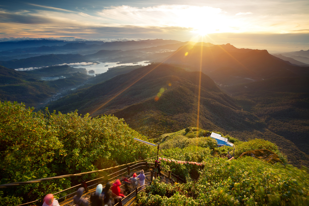 People experiencing the first light from Adam's Peak