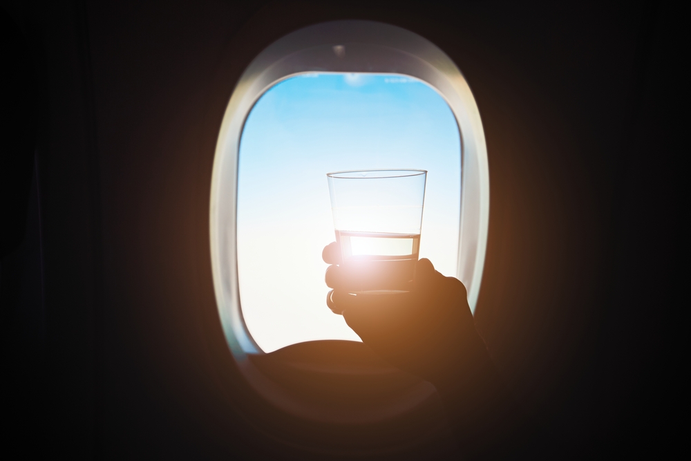 It may be tempting to get a drink on the flight, but alcohol can exacerbate jet lag!