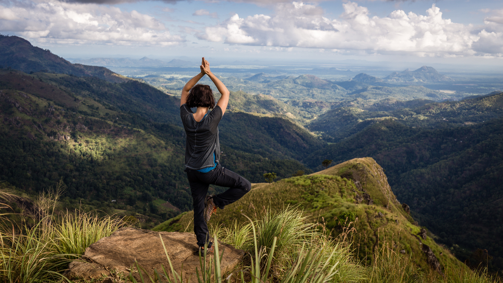 Woman doing yoga on top of Ella