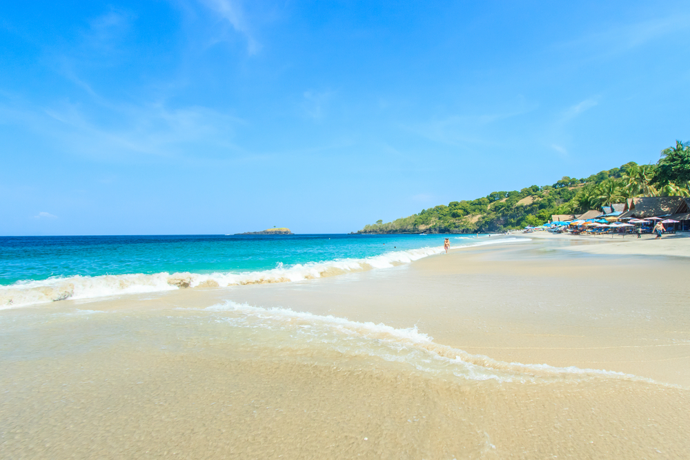 The golden sand and turquoise water of Jimbaran Beach make a postcard-perfect setting.